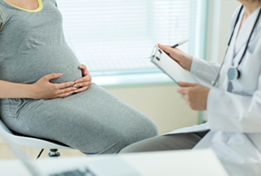 An expectant parent during a prenatal visit